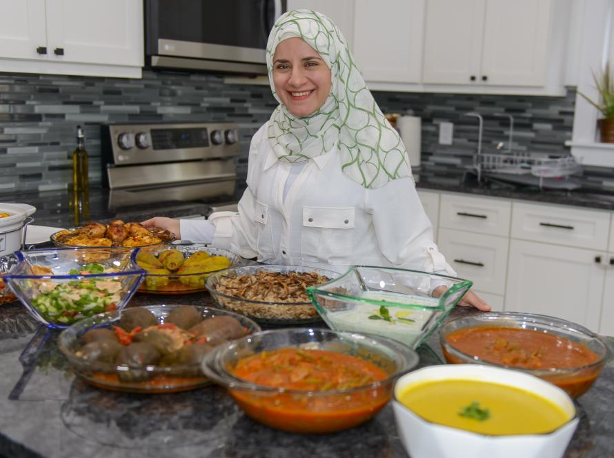 Aya Murad preparing Sufra Cuisine dishes